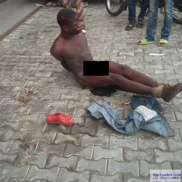 Graphic photos of robber beaten up & stripped naked this morning in Lagos